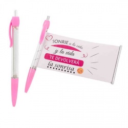 Bolígrafo rosa con un mensaje enrollado de sonrisa
