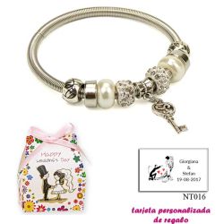 Pulsera con perlas, abalorios y brillantes y colgante con llave corazón