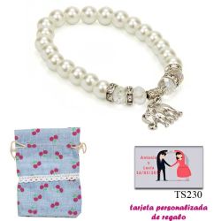 Pulsera de perlas blancas y abalorios con brillantes, y un colgante de elefante