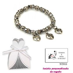Pulsera My Dog con 3 colgantes de corazon y motivos de huella de perritos