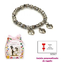 Pulsera My Dog con 3 colgantes de corazon y motivos de huella de perritos