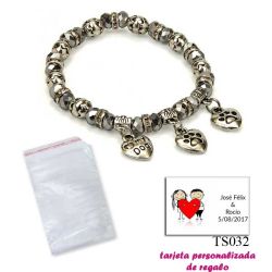 Pulsera My Dog con 3 colgantes de corazon y motivos de huella de perritos