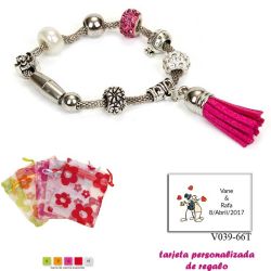 Pulsera de abalorios con detalles en fucsia y borla colgante