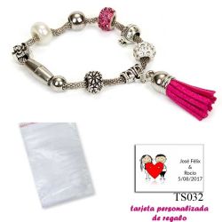 Pulsera de abalorios con detalles en fucsia y borla colgante